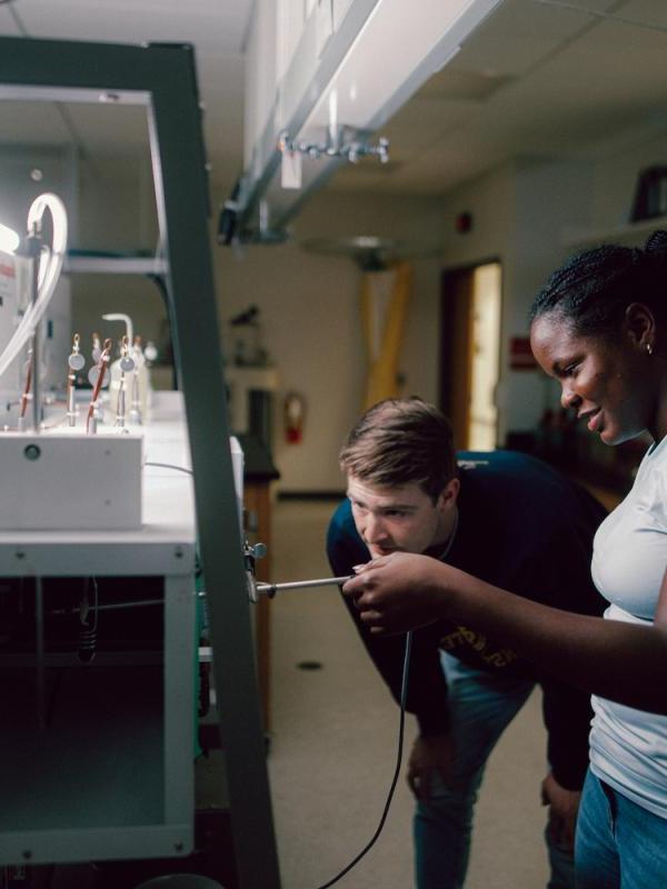 Two students working together in lab